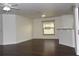 Bright living room with dark laminate flooring and breakfast bar at 1051 Woodlark Dr, Haines City, FL 33844