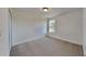 Bright bedroom with carpeted floor and large window at 1901 Banner Ln, Saint Cloud, FL 34769