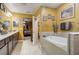 Bathroom with a large soaking tub and walk-in shower at 1041 Bradford Ridge Dr, Leesburg, FL 34748