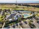 Resort-style pool and clubhouse overlooking golf course at 1049 Carver Ct, The Villages, FL 32163