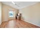 Bedroom with hardwood floors and desk at 1049 Carver Ct, The Villages, FL 32163