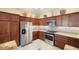 Modern kitchen with stainless steel appliances and granite counters at 1049 Carver Ct, The Villages, FL 32163