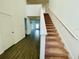 View of staircase leading to the second floor at 13466 Leaping Water Way, Astatula, FL 34705