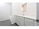 Clean bathroom with white vanity, quartz countertop and bathtub at 13473 Leaping Water Way, Astatula, FL 34705