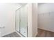 Modern bathroom with a large walk-in shower and closet at 13477 Leaping Water Way, Astatula, FL 34705