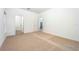 Spacious bedroom featuring plush carpeting and an ensuite bathroom at 13477 Leaping Water Way, Astatula, FL 34705