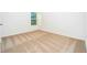 Bright bedroom with neutral carpeting and a window at 13477 Leaping Water Way, Astatula, FL 34705