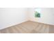 Bright bedroom with carpeted floor and large window at 13477 Leaping Water Way, Astatula, FL 34705