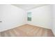Spacious bedroom featuring carpeted floors and a window at 13477 Leaping Water Way, Astatula, FL 34705