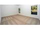 Bright bedroom with neutral carpeting and large windows at 13477 Leaping Water Way, Astatula, FL 34705