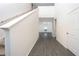 Bright entryway with grey wood-look floors and staircase at 13477 Leaping Water Way, Astatula, FL 34705