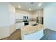 Modern kitchen with stainless steel appliances and an island at 13485 Leaping Water Way, Astatula, FL 34705