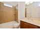 Bathroom with tiled shower, vanity sink, and toilet at 1423 Harbor Ridge Dr, Poinciana, FL 34759