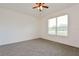 Bedroom with plush carpet and window offering ample natural light at 1423 Harbor Ridge Dr, Poinciana, FL 34759