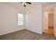Spacious bedroom with plush carpeting, large closet, and bright window at 1423 Harbor Ridge Dr, Poinciana, FL 34759