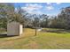 Large backyard with shed and pool in view at 8915 Pinecrest Dr, Lakeland, FL 33809