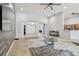 Open living area with a view into the entryway and kitchen with an accent wall at 8915 Pinecrest Dr, Lakeland, FL 33809