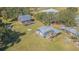 Aerial view showing a main house, a smaller building, and a large yard at 16 Ridge Rd, Frostproof, FL 33843