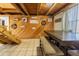 Farmhouse-style dining area with wood paneling and a wooden table at 16 Ridge Rd, Frostproof, FL 33843