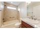 Clean bathroom with tiled shower, vanity sink, and modern fixtures at 5638 Cedar Waxwing Dr, The Villages, FL 32163
