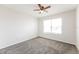 Bright and airy bedroom with neutral carpet and a large window at 5638 Cedar Waxwing Dr, The Villages, FL 32163