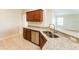 Modern kitchen with granite countertops, stainless steel appliances, and wooden cabinets at 5638 Cedar Waxwing Dr, The Villages, FL 32163