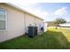 View of the home's central AC unit and exterior at 1046 Roberta Rd, Lake Wales, FL 33853