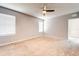 Spacious bedroom with neutral walls and carpeting at 1046 Roberta Rd, Lake Wales, FL 33853