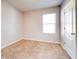 Simple bedroom with carpeted floor, window, and neutral wall color at 1046 Roberta Rd, Lake Wales, FL 33853