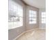 Sunlit dining area featuring tile floors and large windows at 1046 Roberta Rd, Lake Wales, FL 33853