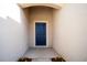 Blue front door and a small covered porch at 1046 Roberta Rd, Lake Wales, FL 33853
