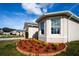 Bay window with landscaping and red mulch at 1046 Roberta Rd, Lake Wales, FL 33853