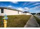 House exterior view showing side yard and sidewalk at 1046 Roberta Rd, Lake Wales, FL 33853