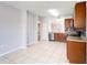 Open kitchen with stainless steel appliances and wood cabinets at 1046 Roberta Rd, Lake Wales, FL 33853