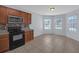 Bright kitchen with stainless steel appliances and wood cabinets at 1046 Roberta Rd, Lake Wales, FL 33853