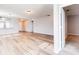 Living room with wood-look flooring and access to another room at 1046 Roberta Rd, Lake Wales, FL 33853