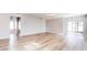 Bright living room with wood-look flooring and access to patio at 1046 Roberta Rd, Lake Wales, FL 33853