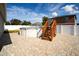 Above ground pool with wooden steps and brick patio at 1046 Roberta Rd, Lake Wales, FL 33853