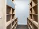 Large walk-in closet with built-in shelves and rod at 1046 Roberta Rd, Lake Wales, FL 33853