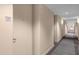 Building hallway with carpeted floors and neutral walls at 150 E Robinson St # 221, Orlando, FL 32801