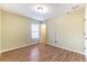 Simple bedroom with wood floors and a closet at 2804 Polson Dr, Kissimmee, FL 34758