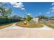 Spacious backyard with a fire pit and concrete patio at 3448 Merdic Ct, Lakeland, FL 33810