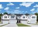 Modern 3-unit townhome building with light gray siding and attached garages at 527 Astera Winds Ln, Lake Mary, FL 32746