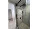 Contemporary bathroom with a frameless glass shower and pebble flooring at 6611 Hereford Dr, Lakeland, FL 33810