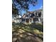 Two-story house with a large yard, three-car garage, and brick accents at 6611 Hereford Dr, Lakeland, FL 33810
