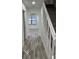Clean hallway with wood-look floors and arched entryway at 6611 Hereford Dr, Lakeland, FL 33810