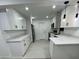 Modern kitchen with white cabinets and quartz countertops at 6611 Hereford Dr, Lakeland, FL 33810