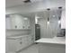 Modern white kitchen with stainless steel appliances and ample cabinet space at 6611 Hereford Dr, Lakeland, FL 33810