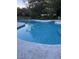 Inviting kidney-shaped swimming pool, ready for summer fun at 6611 Hereford Dr, Lakeland, FL 33810