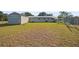 Large backyard with shed and fence at 1407 Sherman Ave, Tavares, FL 32778